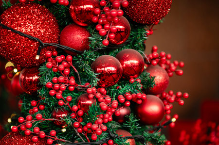 a christmas tree with red balls and berriesの写真素材