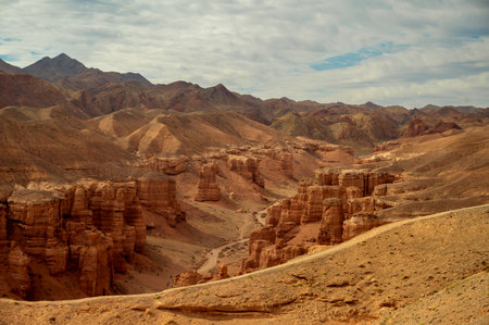 beautiful landscape, orange canyon mountains and cloudy skyの写真素材