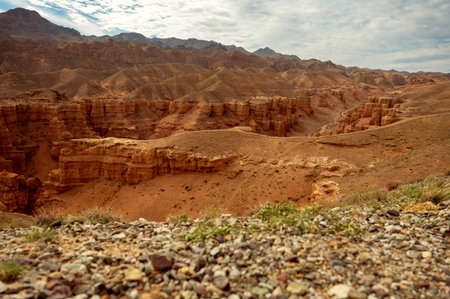beautiful landscape, orange canyon mountains and cloudy skyの写真素材