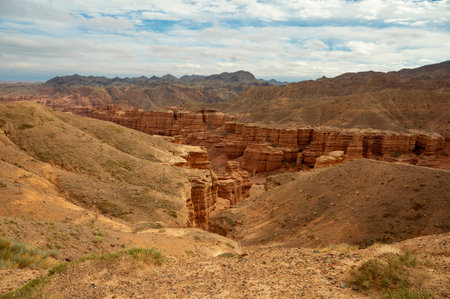 beautiful landscape, orange canyon mountains and cloudy skyの写真素材