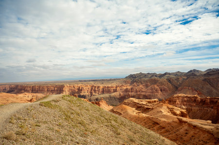 beautiful landscape, orange canyon mountains and cloudy skyの写真素材