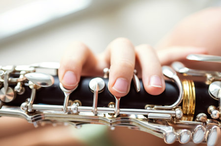 close up of child's hands playing clarinet, selective focusの写真素材