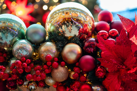 Vibrant multicolored Christmas baubles sparkle on a decorated holiday tree, creating a bright and joyful winter atmosphere filled with warm lights and festive magicの写真素材