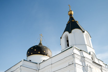 Exterior view of traditional orthodox cathedral architecture featuring white stone walls decorative...