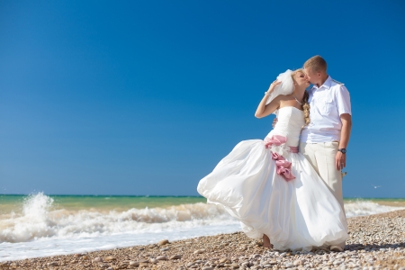 wedding  embracing couple by the seaの写真素材