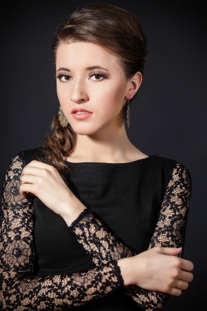 beautiful young woman over black background  Perfect Skin  Beauty Face  Professional Makeupの写真素材