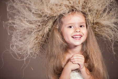 portrait of cute smiling girl with wreath on her headの写真素材