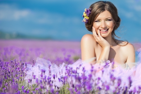 Beautiful bride posing at field of lavenderの写真素材