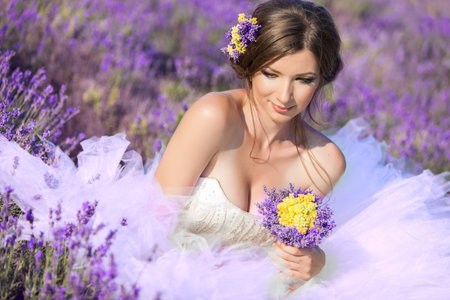 Beautiful bride posing at field of lavenderの写真素材
