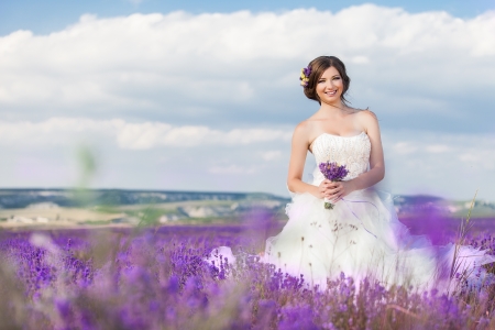 Beautiful bride posing at field of lavenderの写真素材