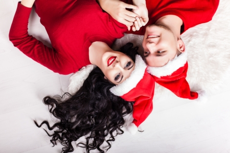 Christmas Couple.Happy Smiling Family at home celebrating. New yearの写真素材