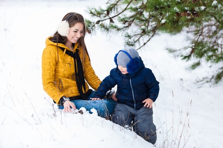 Mother and son enjoying beautiful winter dayの写真素材