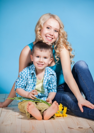 Portrait of a young mother and small son having fun. Family, adorable kid, love and happiness conceptの写真素材