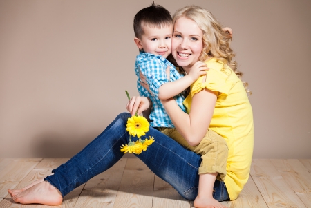 Portrait of a young mother and small son having fun. Family, adorable kid, love and happiness conceptの写真素材