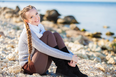 portrait of the young beautiful woman on the beach