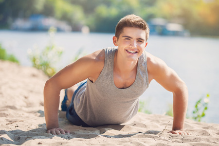 Male fitness model exercise outdoors. Healthy lifestyle concept.の写真素材