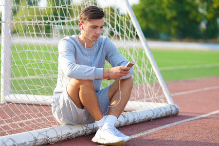 Portrait of a determined young runner at the soccer fieldの写真素材