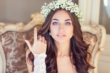 Young beautiful bride with wreath of flowersの写真素材