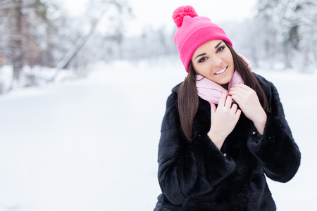 Winter woman in snow outside in nature. Portrait closeup outdoors in snowの写真素材
