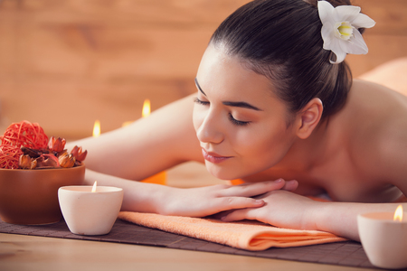 Portrait of young beautiful woman in spa environmentの写真素材