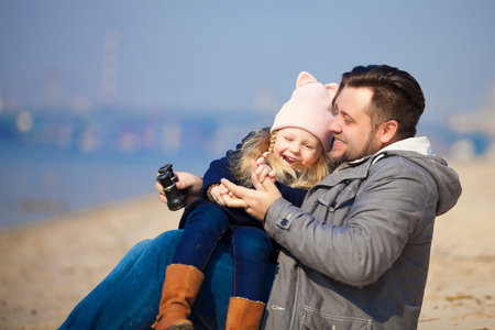 happy young family have fun on beach. Father and daughterの写真素材