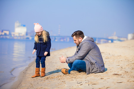 happy young family have fun on beach. Father and daughterの写真素材