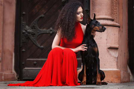 Young beautiful caucasian brunette posing over city backgroundの写真素材
