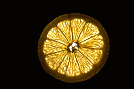 Translucent cut of a ripe citrus grapefruit and lemon slice . Close-up. Macro. Soft focus.