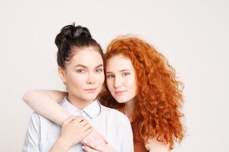 Two young girls hugging each otherの写真素材