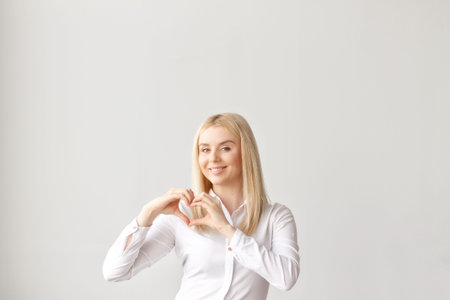 Valentines day, heart hands, a young pretty girlの写真素材