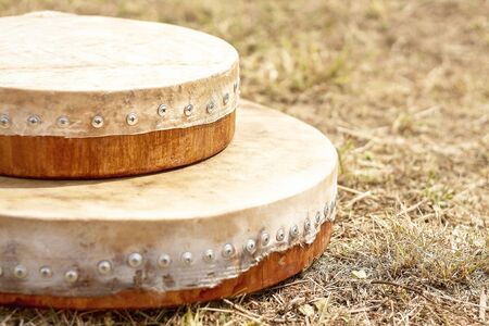 Shamanic tambourine. Shamanic drum. shaman tambourine lies on the grassの写真素材