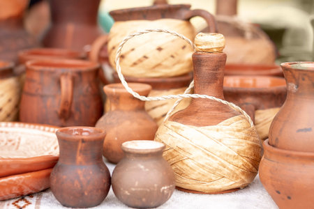 Different pottery products: bowls, vases, jars on the market.