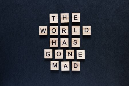 the world has gone mad an inscription on a black backgroundの写真素材
