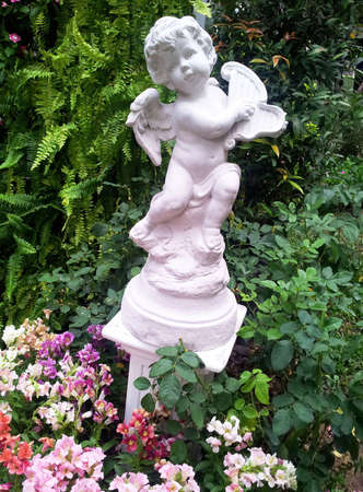Cupid statue in Garden の写真素材