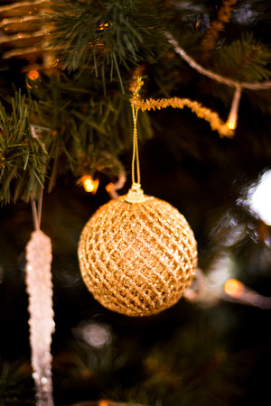 Christmas tree decorated with garlands, ball , sweet and Christmas lights on the background of beautiful bokehの写真素材