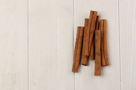 Cinnamon sticks on the table, ingredients and preparation, health benefits of cinnamon, close up,...