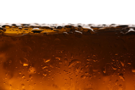 Beer in glass. Close up. White backgroundの写真素材