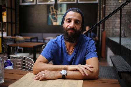 Man with beard in cafeの写真素材