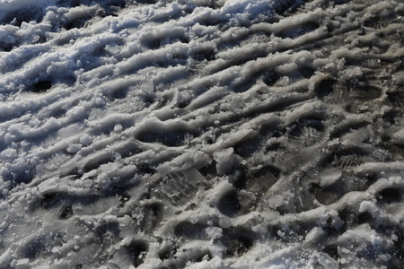 Footprints in dirty snowの写真素材