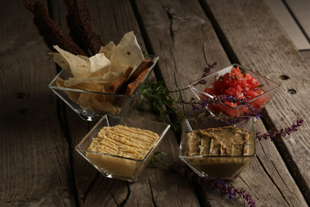 Appetizing kinds of paste on the wooden board