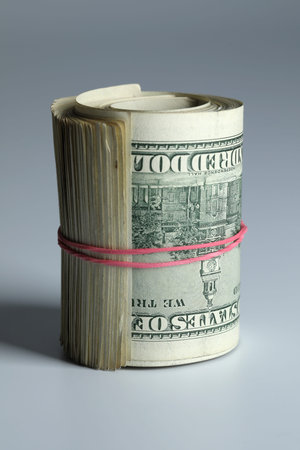Many dollar banknotes on white background. National American currency