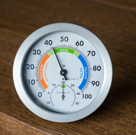 Close-up of hydrometer and thermometer on wooden backgroundの写真素材