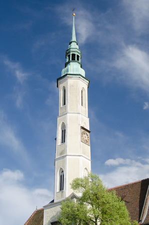 White tower with clock and the bell in Gorlitz, Germanyの写真素材