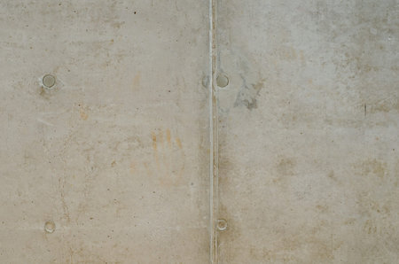 Grungy texture of old gray concrete wall with four circles and line for background. Exposed...