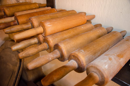 row of rolling pins on the shelf. close up