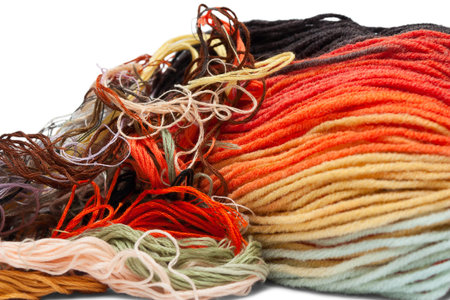 Multi coloured yarn threads isolated on white
