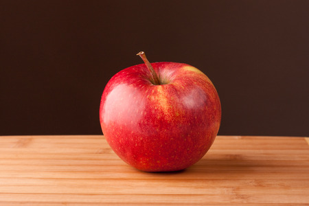 Red apple on the tableの写真素材