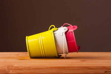 small buckets on the wooden tableの写真素材