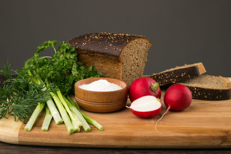 Black bread, radishes, parsley, onion and dill. healthy eatingの写真素材