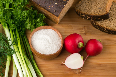 Black bread, radishes, parsley, onion and dill. healthy eatingの写真素材
